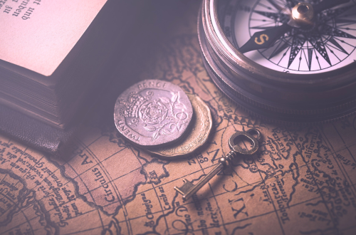 coins, a key, and a compass on a map, denoting travel.